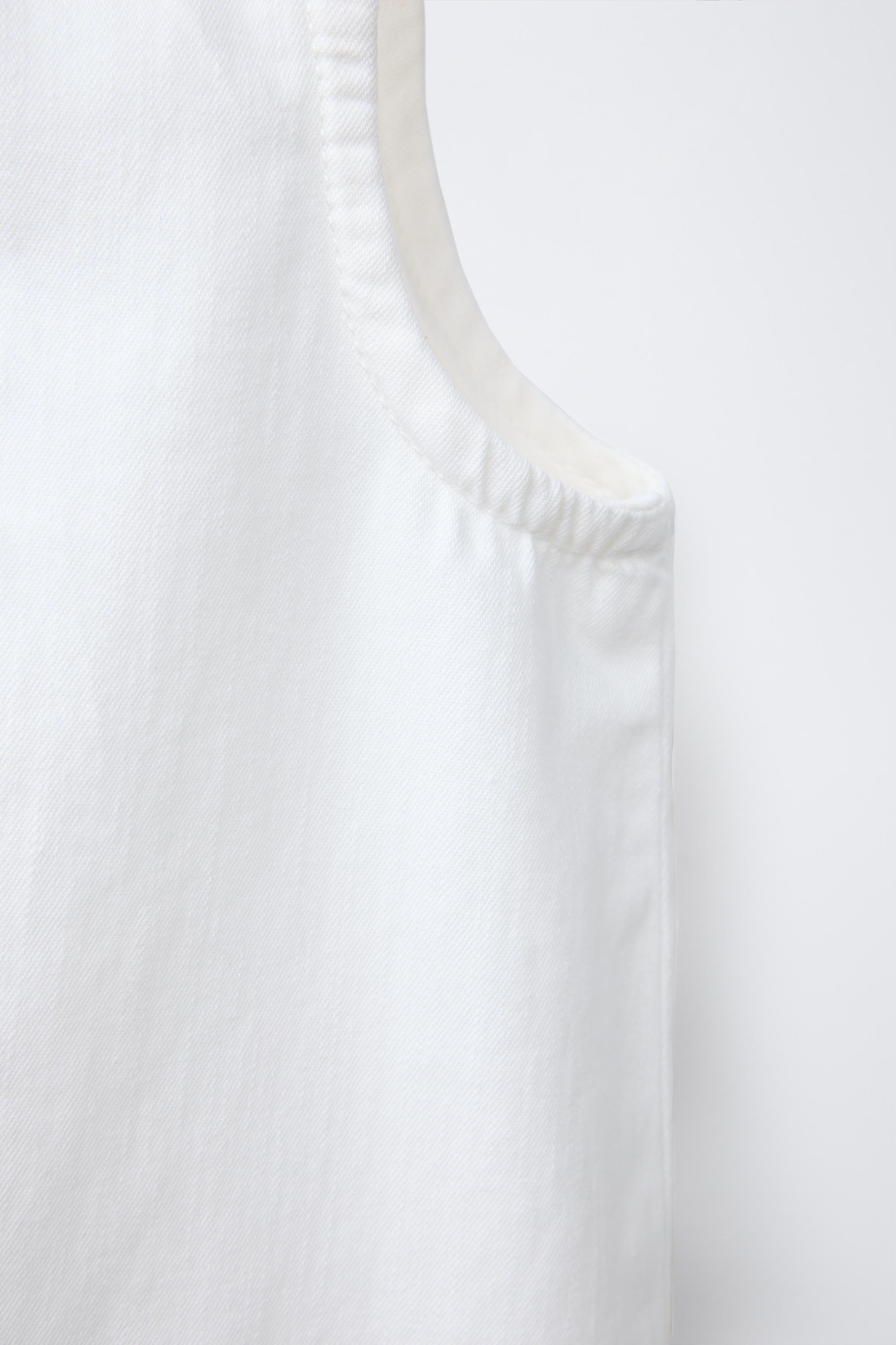 TOP SANS MANCHES ZIP